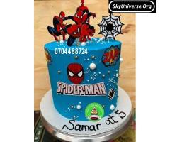 Birthday party cakes in blue with spiderman topper