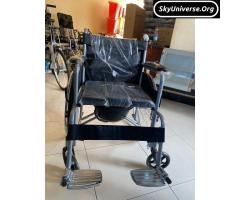 Heavy duty wheelchair with potty and footrests