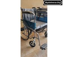 Heavy duty stainless wheelchair with potty and footrests